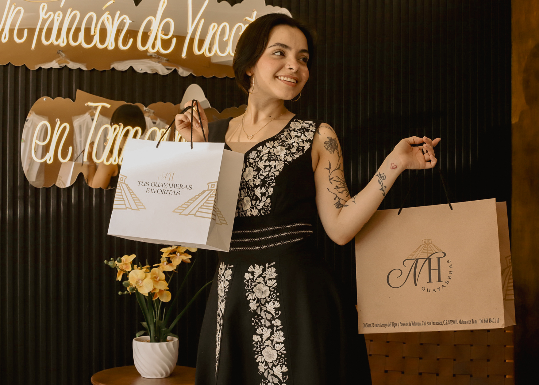 A woman wearing a chic and elegant guayabera dress.